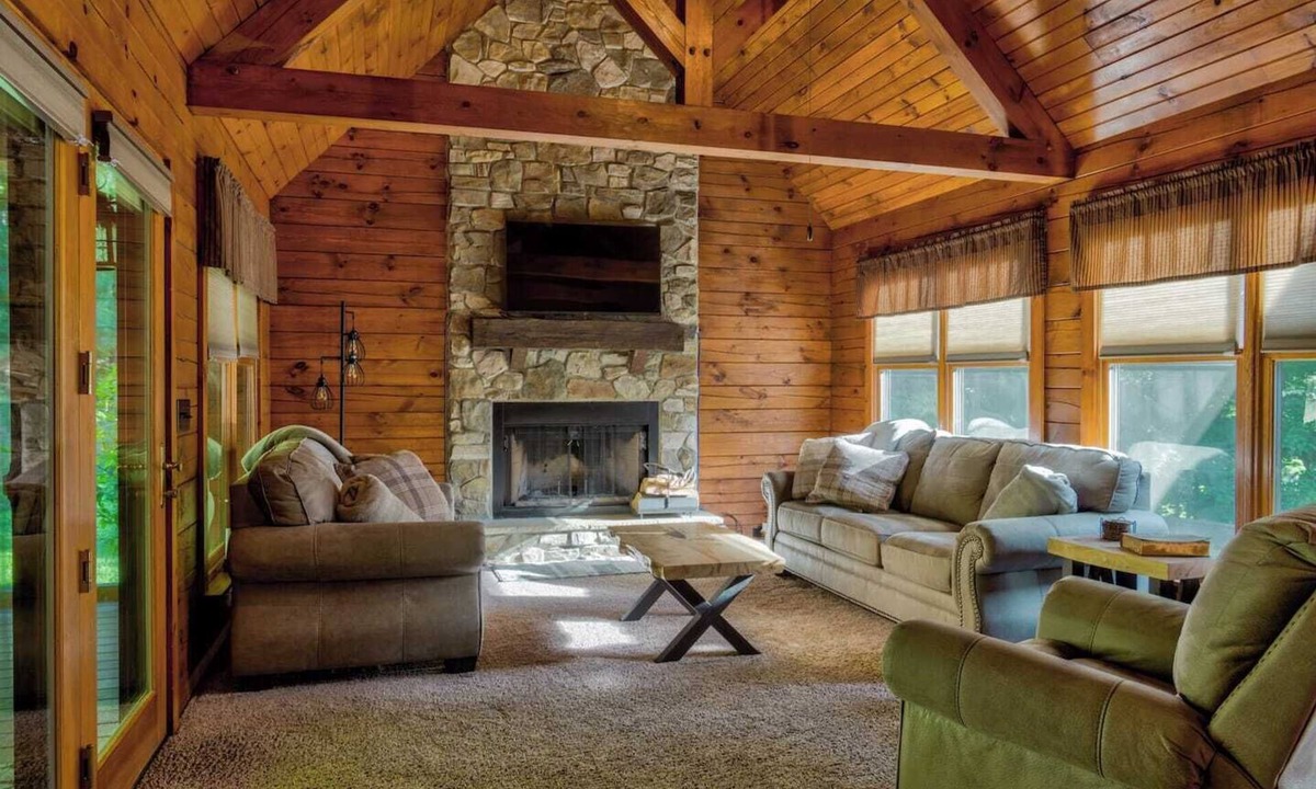 Cedarhurst Cabin | Log Cabin with living room fireplace and hot tub