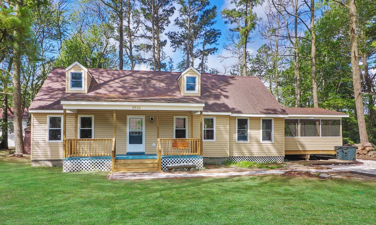 Chincoteague House | Utter East - great home with large screened porch and firepit next to the pond