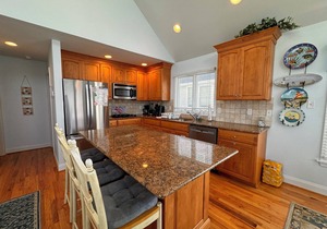 Seashore Sweet Corner Model with great views of the ocean and only steps away to the beach.