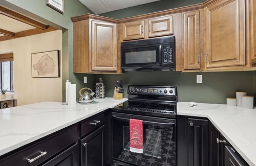 Chalet Village Condo | 🍁 Modern Smoky Mountain Condo- Stream Views, Fireplace & Full-Size Pool Table