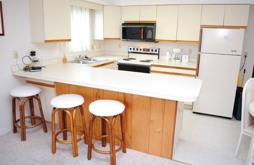 Caine Woods Condo | Quaint, but pristine 2-bedroom condo with free WiFi and an outdoor pool located uptown on the bayside in a peaceful, family-friendly neighborhood!