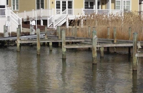 Heron Harbour Isle House | 5-6BR, 5BA in Bayside Retreat with Community Pools & Boat Slip