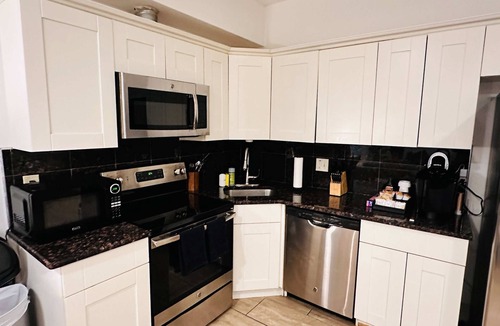 Chinatown Apartment | Arcade 2BR Apt in Walk-up w Laundry