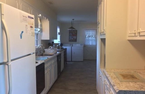 North Shores House | Canal-Front Retreat: 5BR Home w/Private Dock, Porch, Beach & Pool Access!