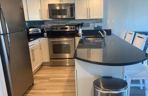 Rehoboth by the Sea Condo | Charming 2-Bedroom Condo in Dewey Beach, Pool, 1 Block to Ocean & Walk to Town!