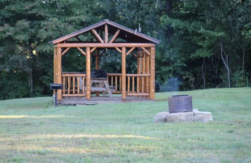 Kerr Apartment | Charming one-room cabin retreat with private bath, kitchenette and log gazebo.