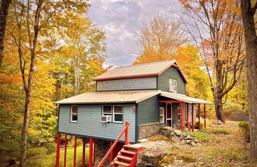 Smallwood Cabin | Chic Treehouse Cabin with Pedal Boat, Hot Tub, BBQ, Fire Pit, SUPs, & Lake Access