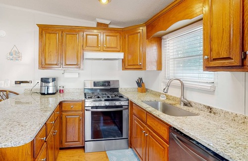 Assateague Pointe House | Comfortable home with tennis court, jetted tub, pool, W/D, patio, & full kitchen