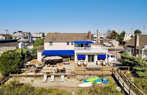 Avalon House | ENJOY BAY VIEWS! Bayfront home, shady front porch 2 boat docking areas, gameroom to watch TV, A short bike ride or walk to Avalon's fine business district for ice cream, dining, mini golf, shopping and more.