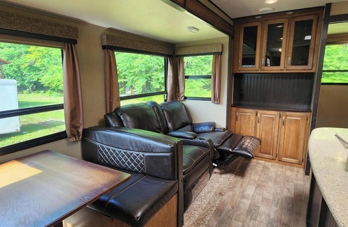 Helvetia RV Rental | Glarus - Riverside 36' RV, trout stream firepit