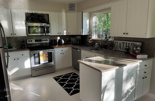 Medford House | Lakefront home in a Tree Fort like setting perched above the Spectacular Lake!