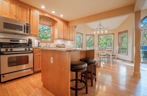 East Stroudsburg House | Lakefront Mansion w/3 Decks, Hot Tub, Boats, & Game Room!