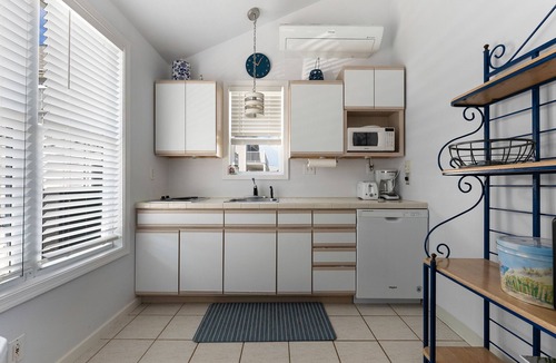 Townsend's Inlet Cottage | Light filled carriage house with gorgeous wrap around deck, ready for a perfect vacation getaway.