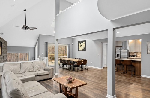 Bushkill House | Modern Creek-front House with Volleyball court in the backyard.