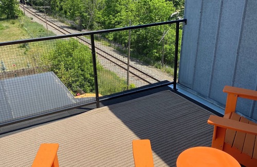 Warwick Apartment | Modern penthouse suite in a restored grain tower with private roof deck.