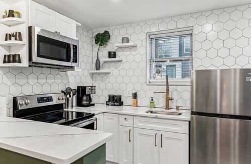 Kensington House | Modern Two Bedroom Family Retreat, Fireplace outside of Fishtown