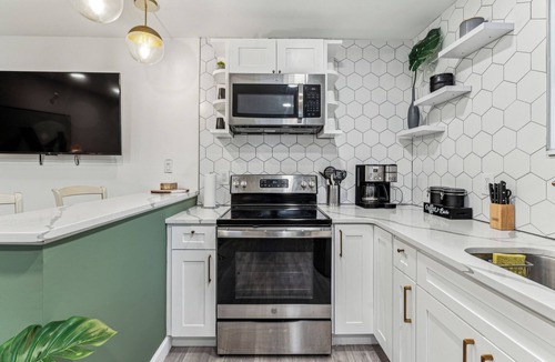 Kensington House | Modern Two Bedroom Family Retreat, Fireplace outside of Fishtown