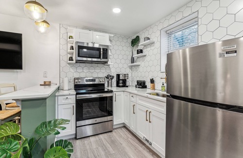 Kensington House | Modern Two Bedroom Family Retreat, Fireplace outside of Fishtown