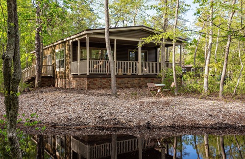 Galloway House | Modern waterfront fireplace in bedroom/bath jetted tub walk in shower no steps