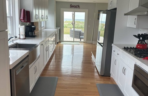Long Branch House | Ocean Front Beauty with Private Beach, Grass Yard, Beach Volleyball and. More!