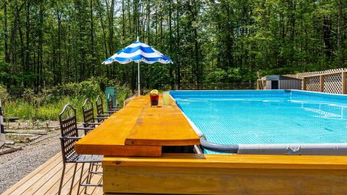 New Paltz House | PoolHot Tub Firepit Near Hikes Shops Dining Cragswood Lodge by AvantStay