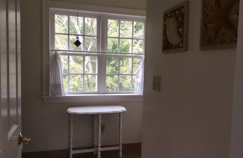 Cape May Point House | Pristine, Cozy, 4 bedroom Beach Cottage with a 40 foot screened in front porch!