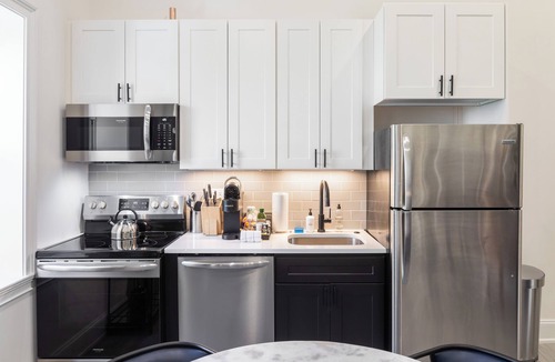 Rittenhouse Row Apartment | Sosuite | Penthouse 1BR Apt w Arch Windows, W/D