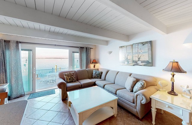 Central bayfront townhouse in with beautiful decks, sunset views, AC & fireplace