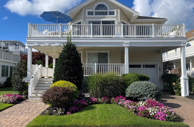 Master Suite with private deck full bath with jacuzzi tub, Large wrap around deck to dinner with the family. Beach path is on 48th Street to one of most desirable beach locations on the island.