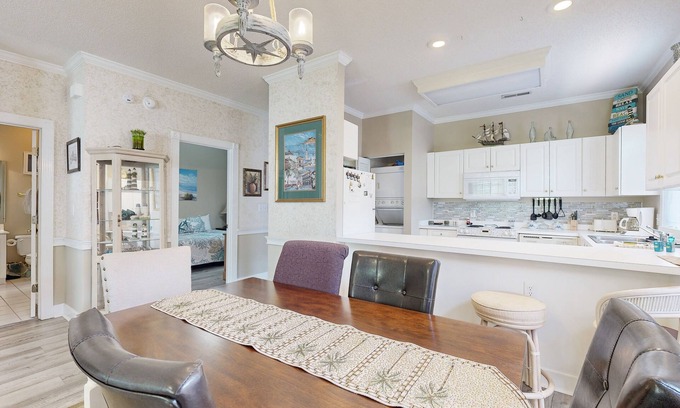 Arcadian Shores Condo | End-unit condo with covered patio, pool, tennis & washer/dryer - dog-friendly