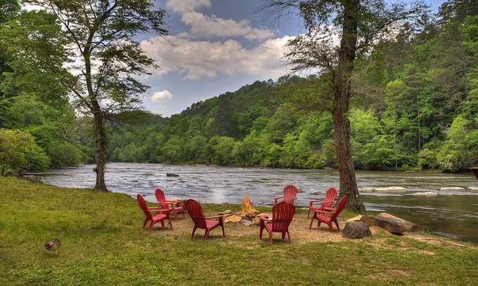 Ellijay Cabin | Hunter's Lodge, a pet-friendly riverfront cabin, complete with a pool table, lit basketball court, fire pit, dock, and WiFi