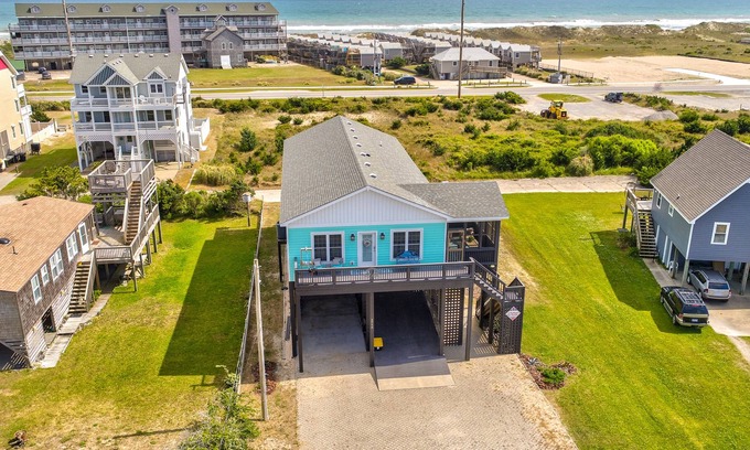 Hatteras House | Welcoming home with screened porch, outdoor shower, elevator & central AC