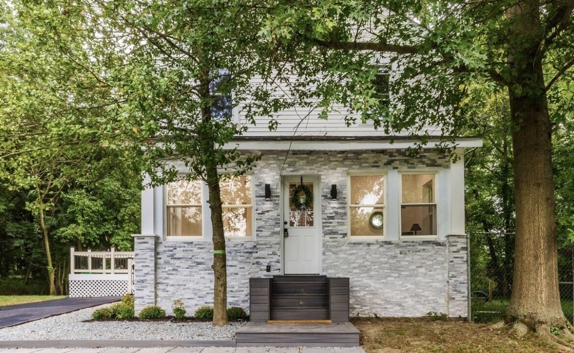 Mickleton House | Embrace the charm of our creekside haven featuring 4BR 3BA yoga and BBQ deck.