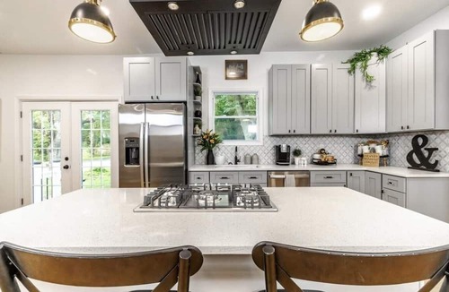 Mickleton House | Embrace the charm of our creekside haven featuring 4BR 3BA yoga and BBQ deck.